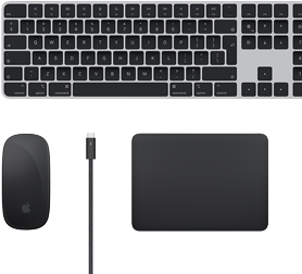 Top view of Mac accessories: Magic Keyboard, Magic Mouse, Magic Trackpad and Thunderbolt cables.